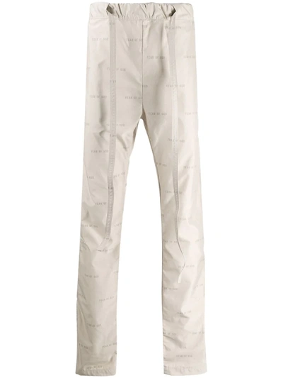 Fear Of God Logo Print Track Pants In Neutrals