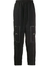 A-cold-wall* Logo Print Taped Nylon Track Pants In Black