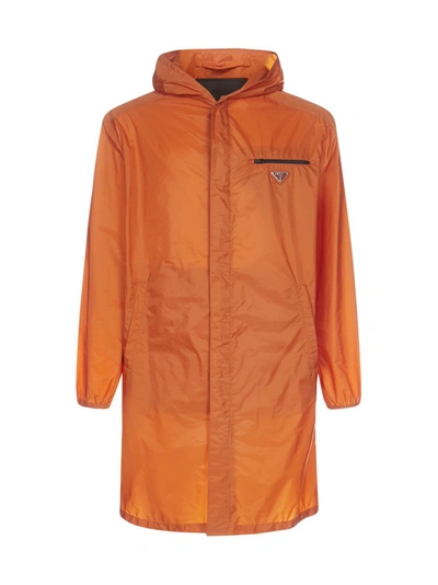 Prada Logo-plaque Nylon Piuma Hooded Raincoat In Orange