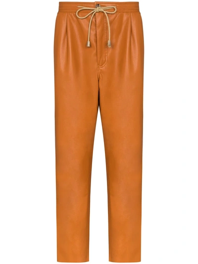Nanushka Tuan Faux Leather Track Trousers In Orange
