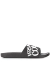 Versace Jeans Couture White Embossed Logo Rubber Slippers In Black