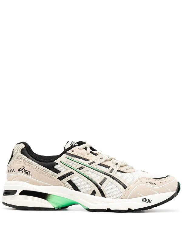multi coloured asics trainers