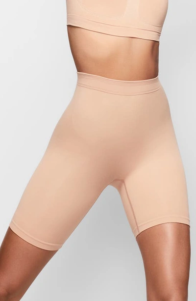 Skims Sculpting Mid Thigh Shorts In Ochre