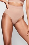 Skims Sculpting Seamless Mid Waist Briefs In Sienna