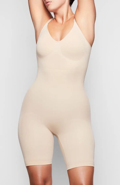 Skims Sculpting Seamless Mid-thigh Bodysuit In Sand