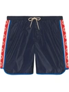 Gucci Nylon Swim Shorts With Logo Stripe In Blue