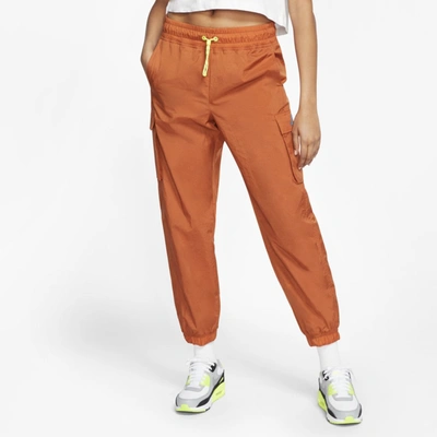 Nike Sportswear Icon Clash Women's Woven Pants (desert Orange) In Desert Orange,lemon Venom