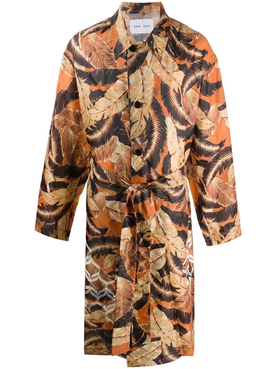 Cmmn Swdn Leaf-print Belted Trench Coat In Orange