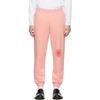 Martine Rose Tapered Logo-print Loopback Cotton-jersey Sweatpants In Peach