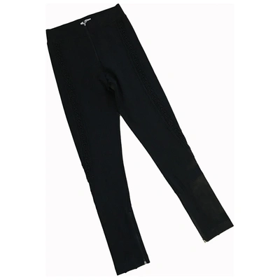 Pre-owned Ganni Black Polyester Trousers