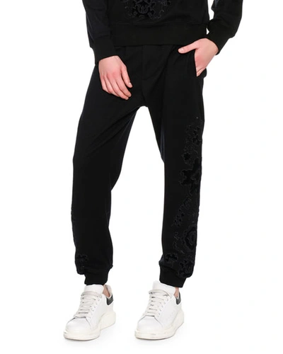 Alexander Mcqueen Flocked-embellishment Sweatpants In Black