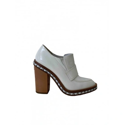 Pre-owned Chanel Patent Leather Ankle Boots In White