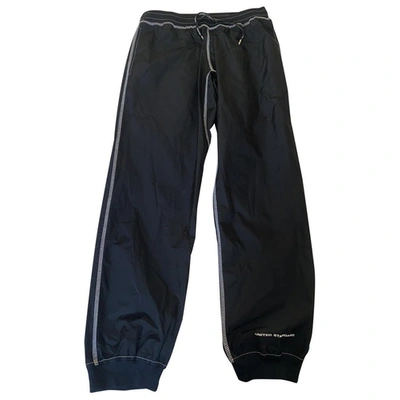 Pre-owned United Standard Trousers In Black