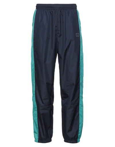 Acne Studios Face Patch Panel Outseam Nylon Track Pants In Blue