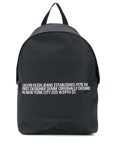 Calvin Klein Round Logo-print Backpack In Black