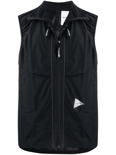 And Wander Shell Hooded Gilet In Black