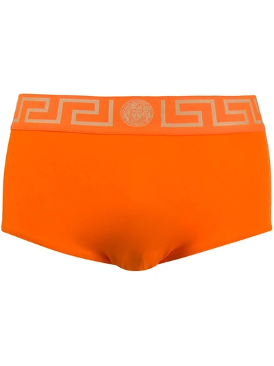 Versace Greca-print Swimming Trunks In Orange