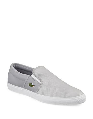 Lacoste Cam Perforated Slip-ons | ModeSens