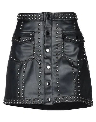 Tpn Mini Skirts In Black