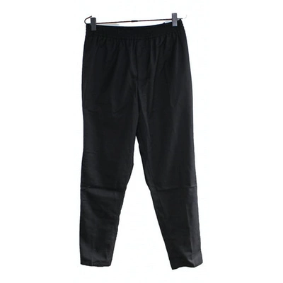 Pre-owned Carven Trousers In Black