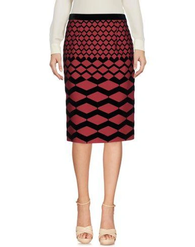 Giulietta Knee Length Skirts In Brick Red