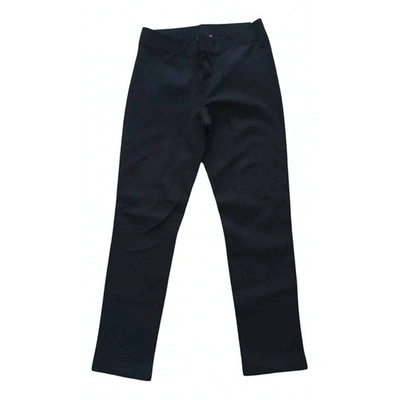 Pre-owned Dkny Trousers In Black