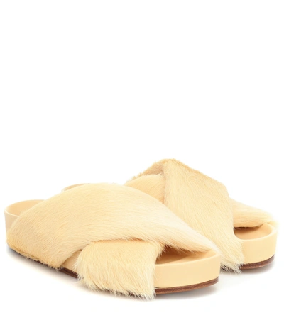 Jil Sander Shearling And Leather Slides In Yellow