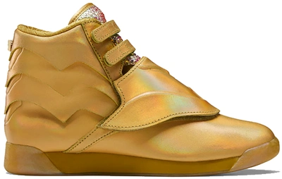 Pre-owned Reebok Freestyle Hi Dc Wonder Woman Gold (women's) In Gold Metallic/gold Metallic-excellent Red