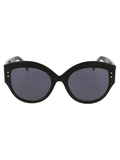 Alaïa Round Acetate Sunglasses W/ Perforated Arms In 001 Black Black Grey
