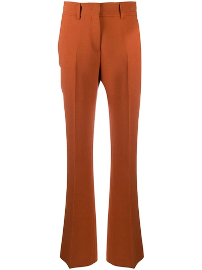 Gabriela Hearst Starr Flared Wool Trousers In Orange
