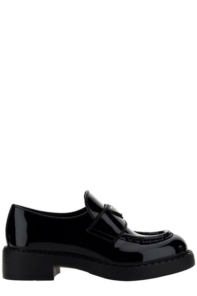 Prada Enamel Triangle Logo Plaque Loafers In Black