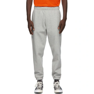 Carhartt Chase Tapered Logo-embroidered Mélange Fleece-back Cotton-blend Jersey Sweatpants In Grey