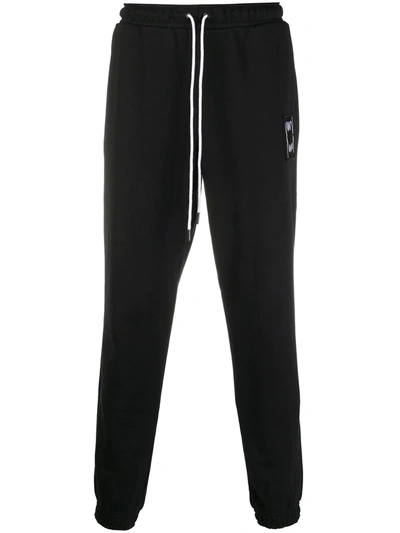 Puma Logo-patch Tapered Track Trousers In Black