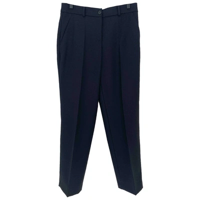 Pre-owned Moschino Wool Trousers In Black