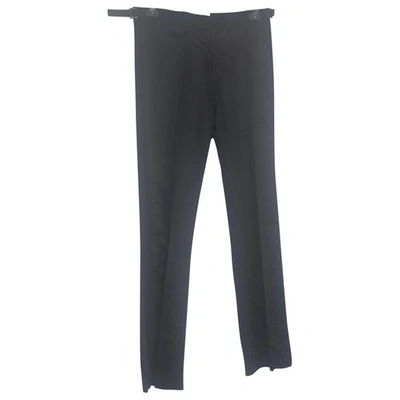 Pre-owned John Galliano Wool Trousers In Black
