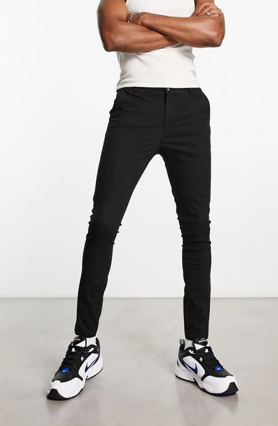 Asos Design Spray On Jeans In Power Stretch Denim In Black