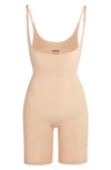 Skims Open Bust Bodysuit In Mica