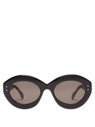 Alaïa Oval Acetate Sunglasses In Black