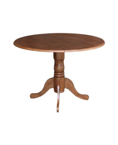 International Concepts Round Dual Drop Leaf Pedestal Table In Brown