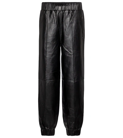 Ganni Leather Tapered-fit Trousers In Black