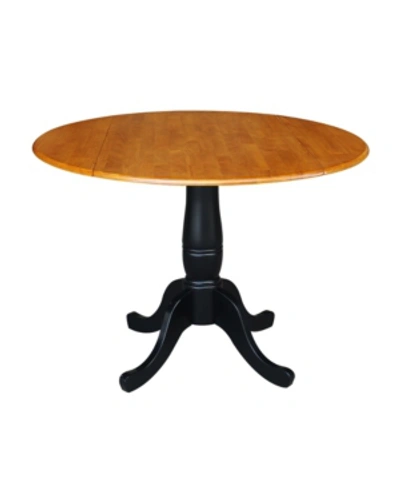 International Concepts International Concept 42" Round Dual Drop Leaf Pedestal Table In Black Cherry