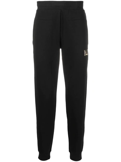 Ea7 Logo Tapered Track Pants In Black