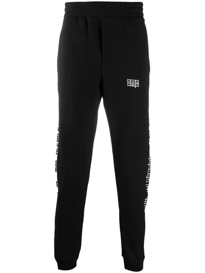 Omc Multiple Print Track Trousers In Black