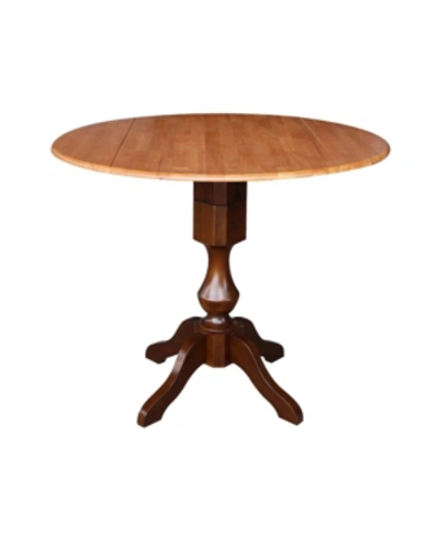 International Concepts International Concept 42" Round Dual Drop Leaf Pedestal Table In Brown