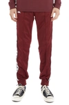 Kappa 222 Banda Rastoriazz Track Pants In Red Dahlia - White