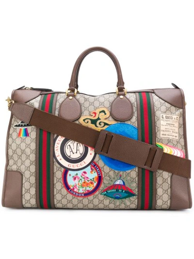 Gucci Courrier系列的柔软gg Supreme高级人造帆布行李包 In Brown