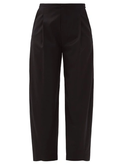 Totême Pleated Wool-blend Flannel Trousers In Black