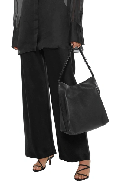 The Row Wander Pebbled-leather Shoulder Bag In Black