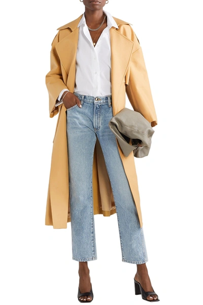 Khaite Matthias Belted Cotton-gabardine Trench Coat In Mustard