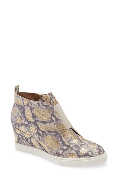 Linea Paolo Felicia Iii Wedge Sneaker In Gold Snake Print Leather